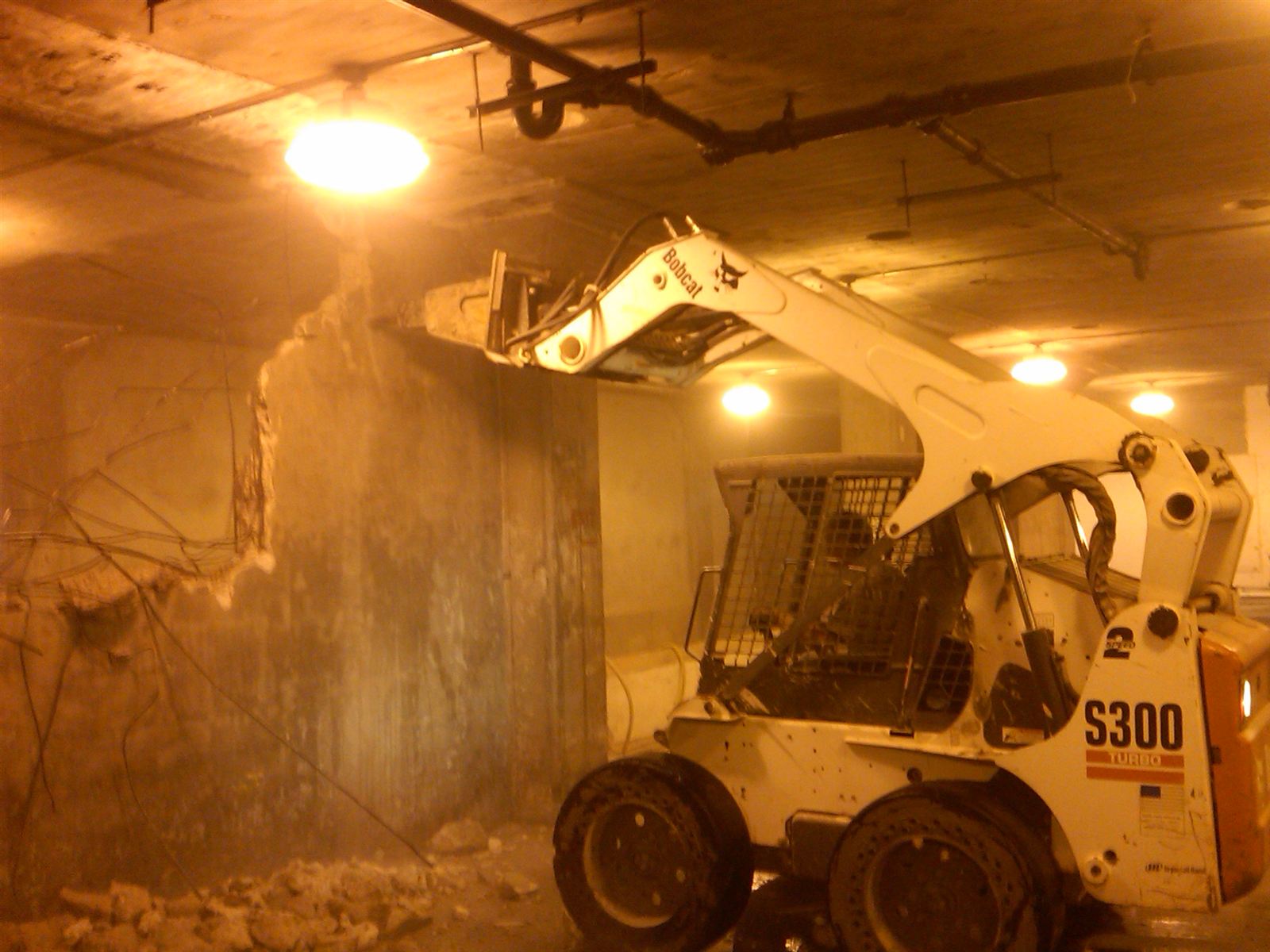 Skid steer wall demolition